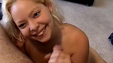 A stunning blonde eagerly sucks his tiny dick