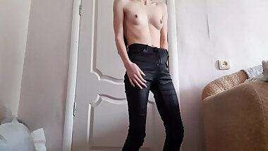 Skinny girl masturbates in leather pants