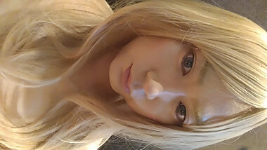 A blonde cross-dressing boy masturbated in a swimsuit