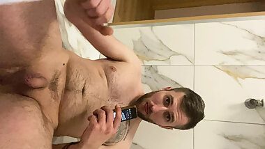 Young man in hotel is getting his cock hard and cum